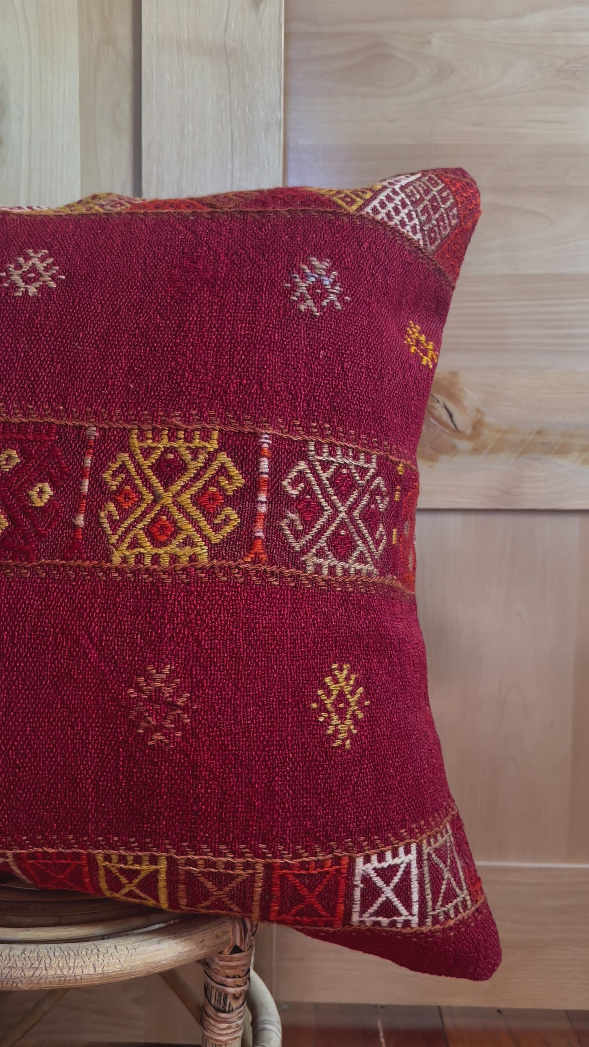 Handwoven red embroidered Turkish throw pillow, 26x26 inches, wool front with geometric design and pops of yellow and white, cotton backing—boho home decor.