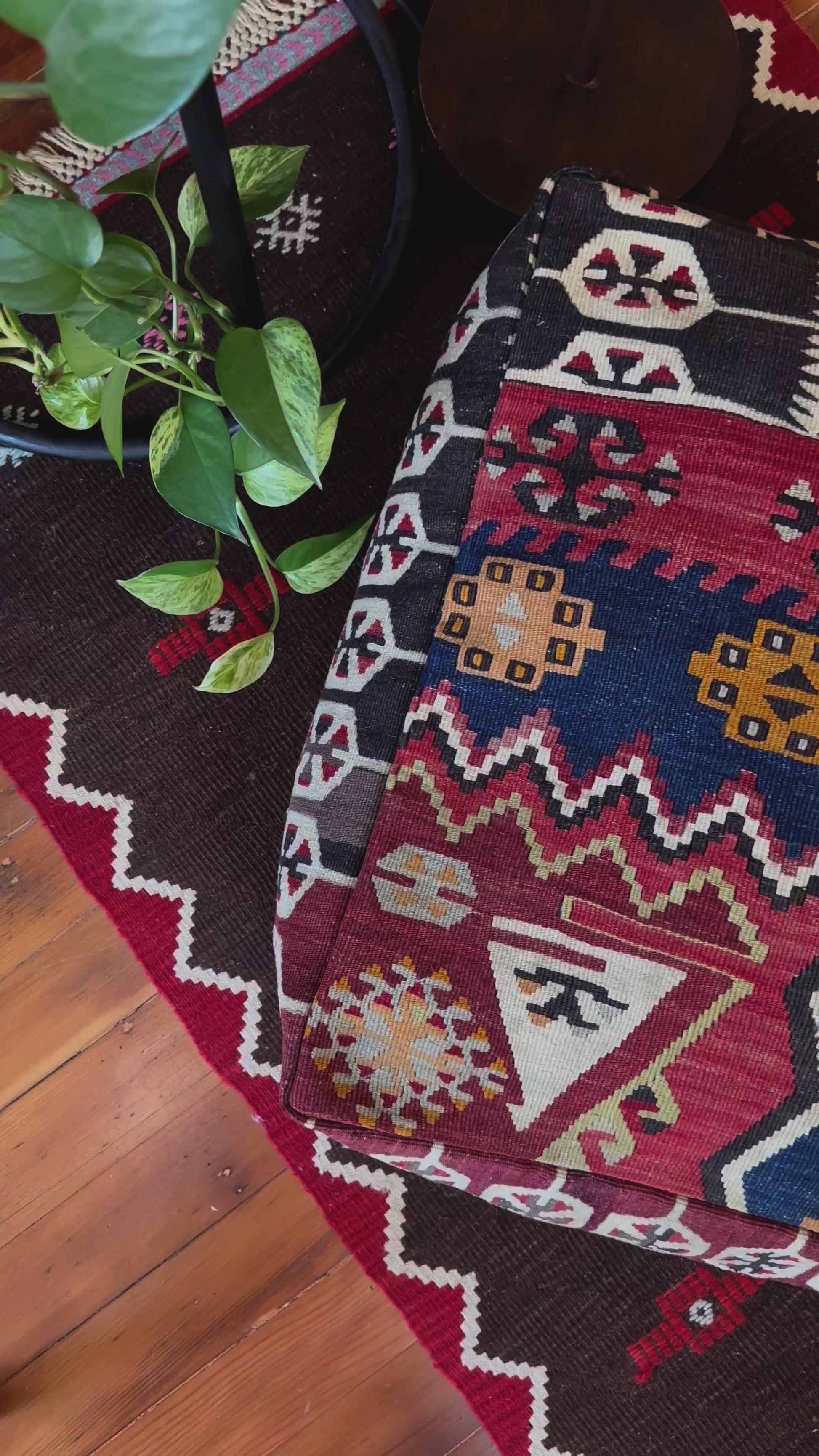 Handmade vintage Turkish rug pouf with geometric colorful tones, up-cycled from authentic wool Kilim rugs. Perfect as a unique bohemian floor cushion, ottoman, or accent seating for living rooms, bedrooms, or cozy spaces. Ethically crafted by artisans in Turkey.