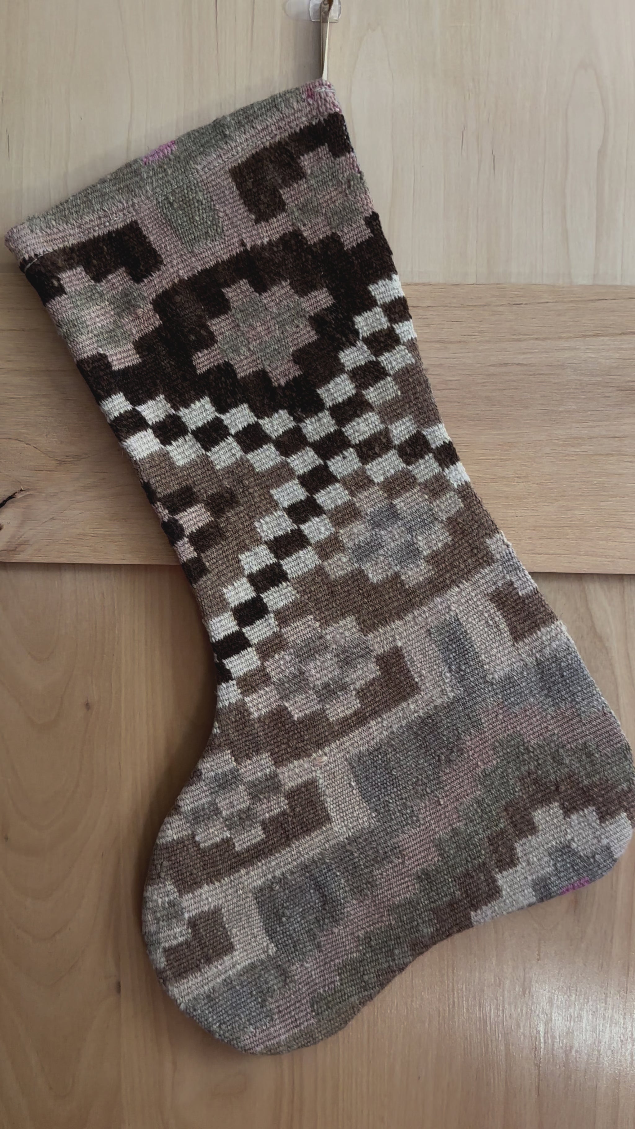 brown and cream handmade Turkish Christmas stocking featuring checkered lines and other geometric shapes